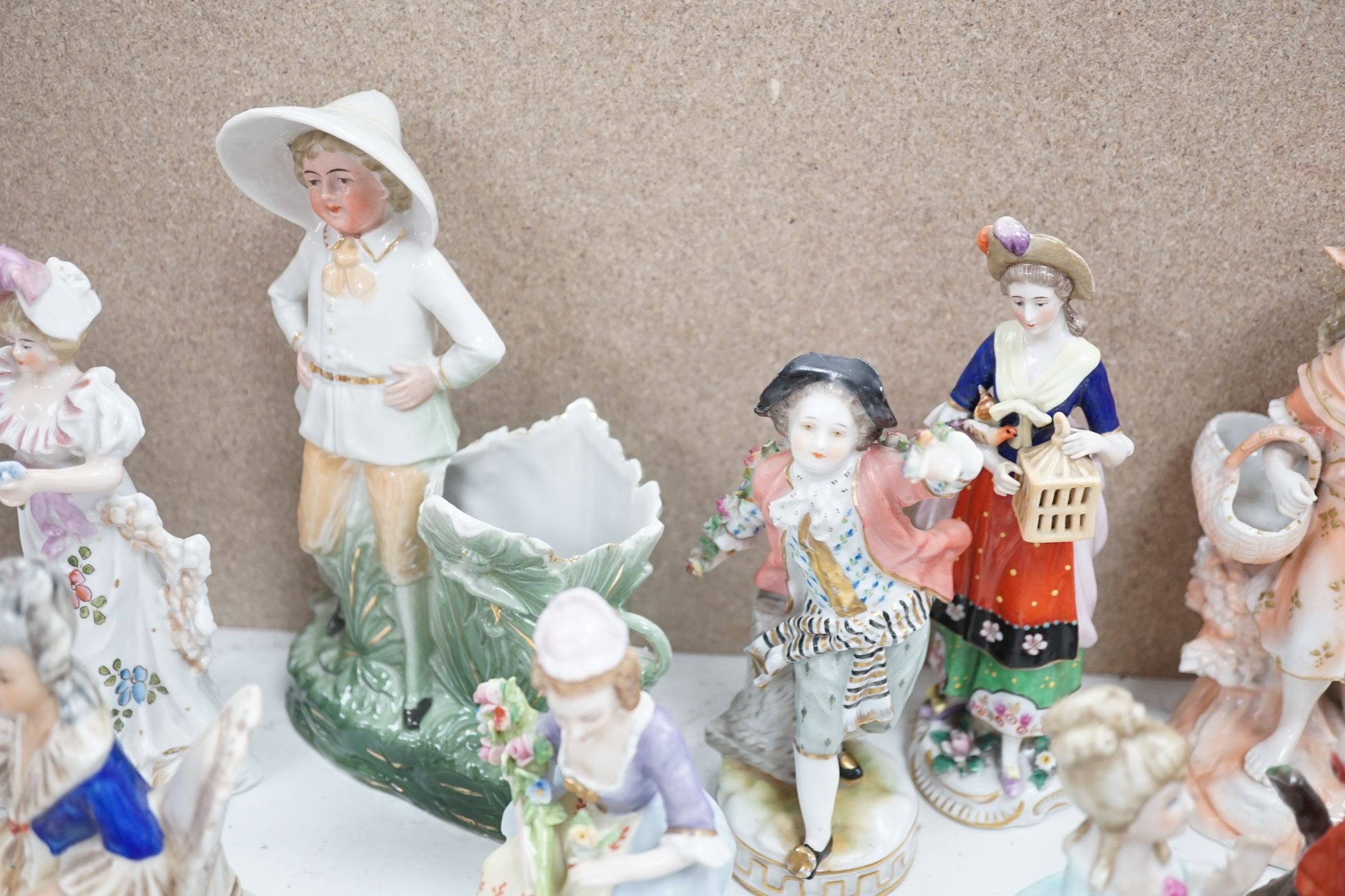 A large collection of small to medium German, French and English porcelain figurines and groups, tallest 18cm